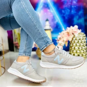 Tenis new balance gris con azul